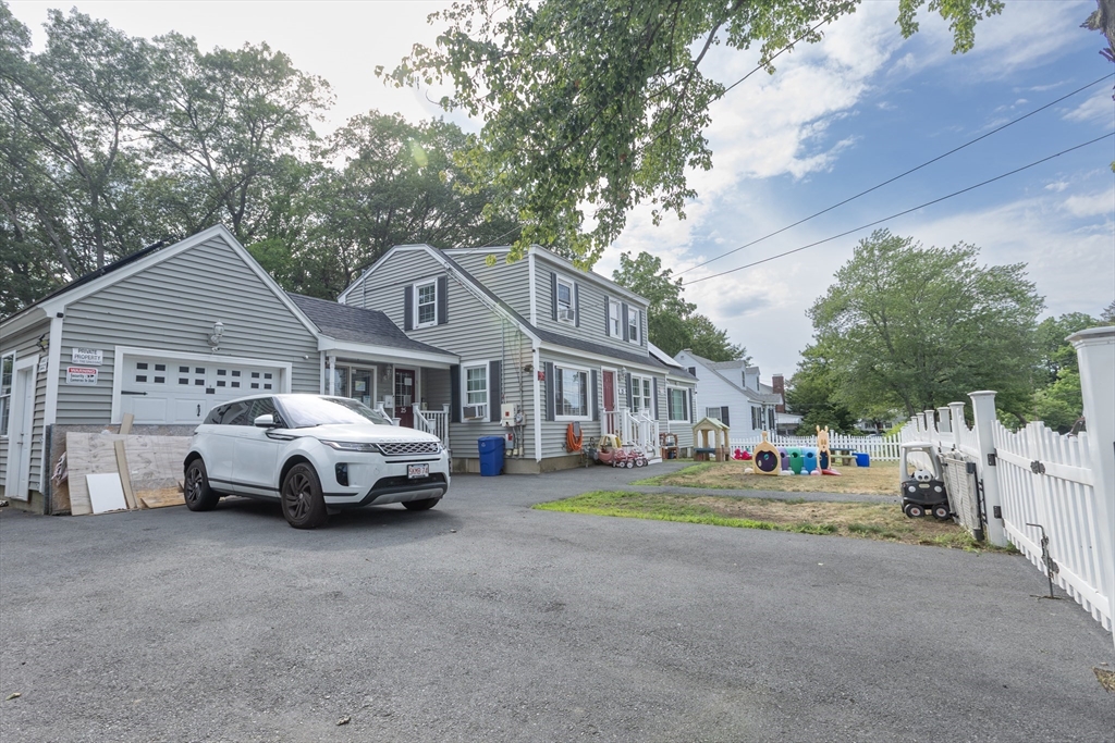25 Beaconsfield Street Lawrence, MA 01843 - Photo 3 of 36 a car parked in front of a house