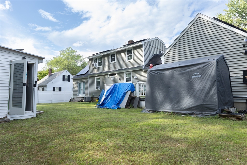25 Beaconsfield Street Lawrence, MA 01843 - Photo 9 of 36 a view of a house with a yard and sitting area