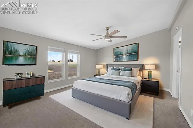a spacious bedroom with a bed and a flat screen tv
