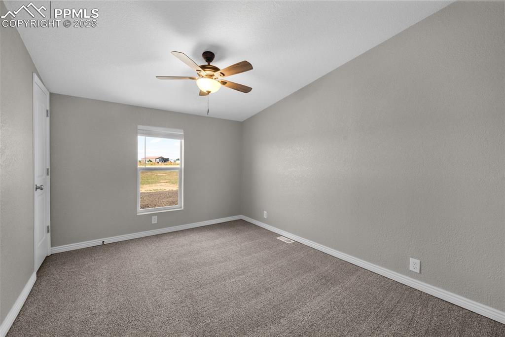515 South Calhan Highway Yoder, CO 80864 - Photo 13 of 34 a view of an empty room with a window