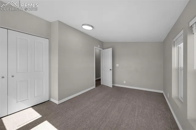 a view of an empty room and window