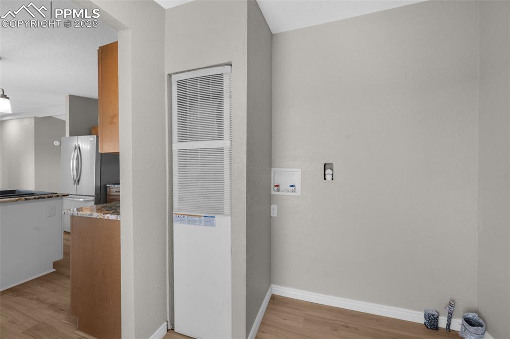 515 South Calhan Highway Yoder, CO 80864 - Photo 18 of 34 a view of a kitchen from the hallway