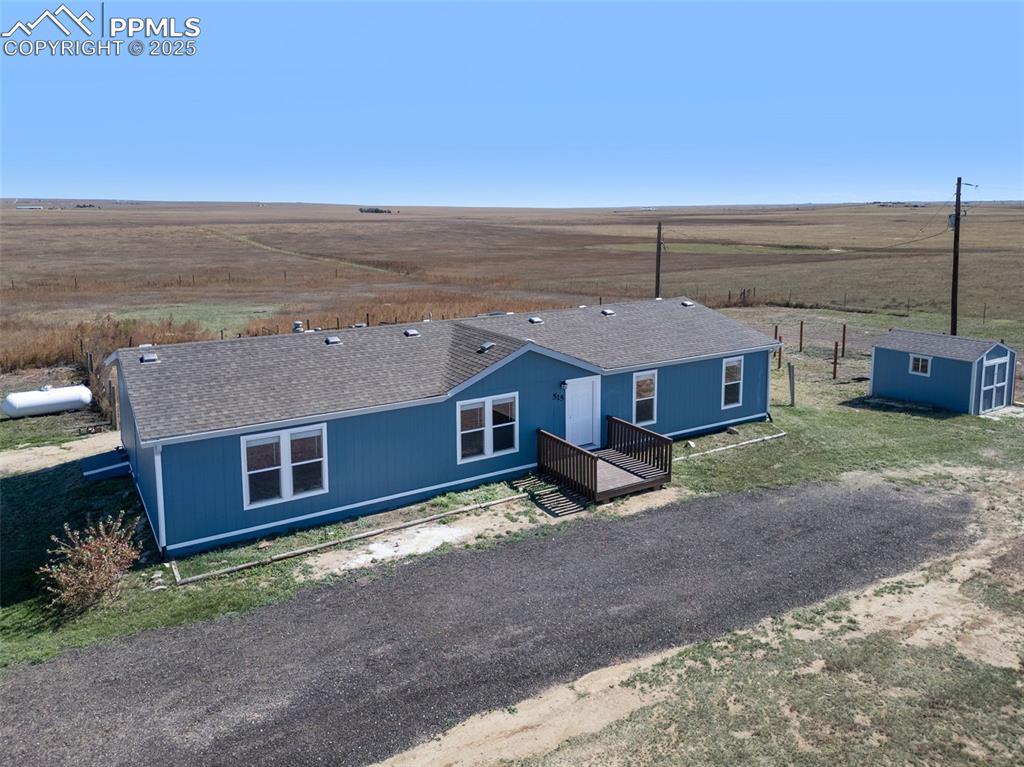 515 South Calhan Highway Yoder, CO 80864 - Photo 27 of 34 a front view of a house with a yard