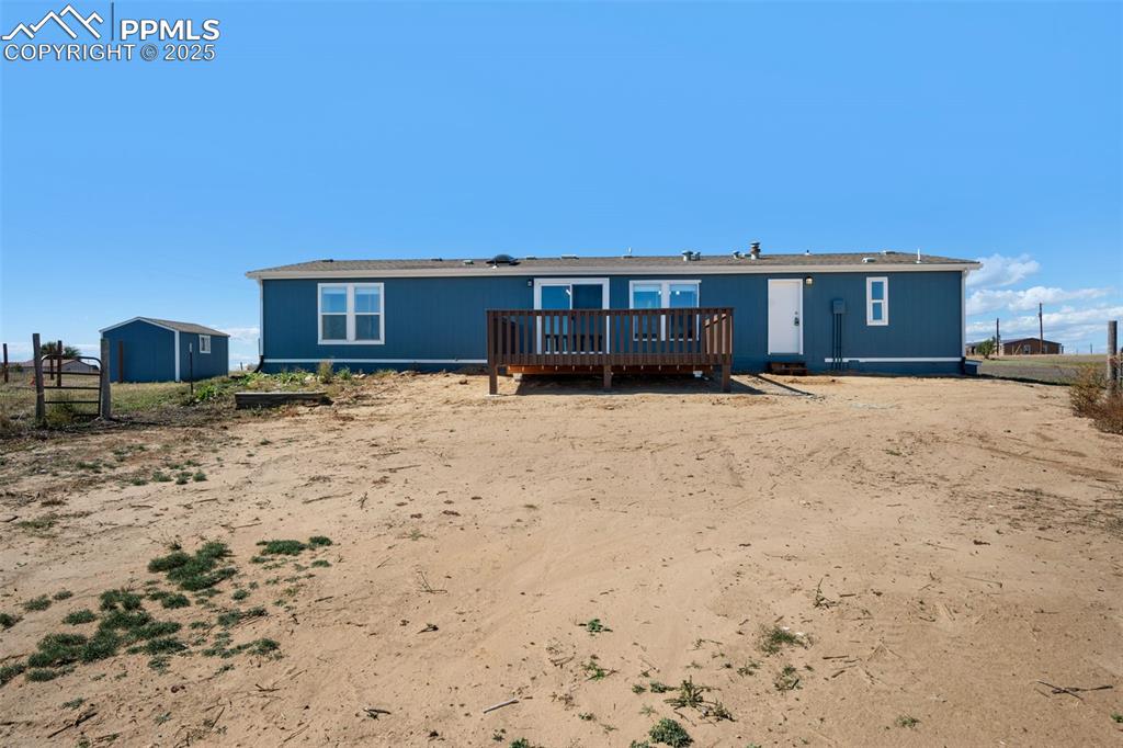 515 South Calhan Highway Yoder, CO 80864 - Photo 29 of 34 a view of a house with a yard