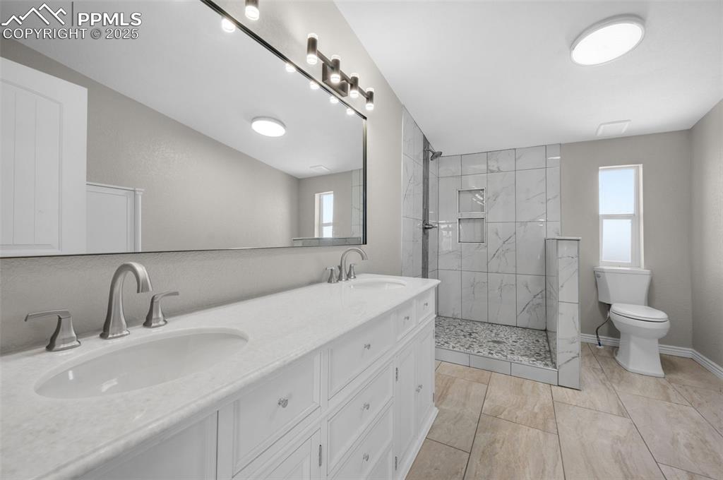 515 South Calhan Highway Yoder, CO 80864 - Photo 3 of 34 a bathroom with a sink a toilet and shower