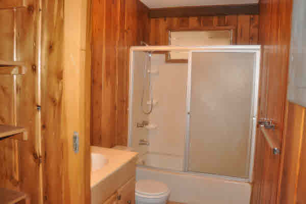 4875 Moi Road Hanapepe, HI 96716 - Photo 12 of 25 a bathroom with a granite countertop sink toilet and shower