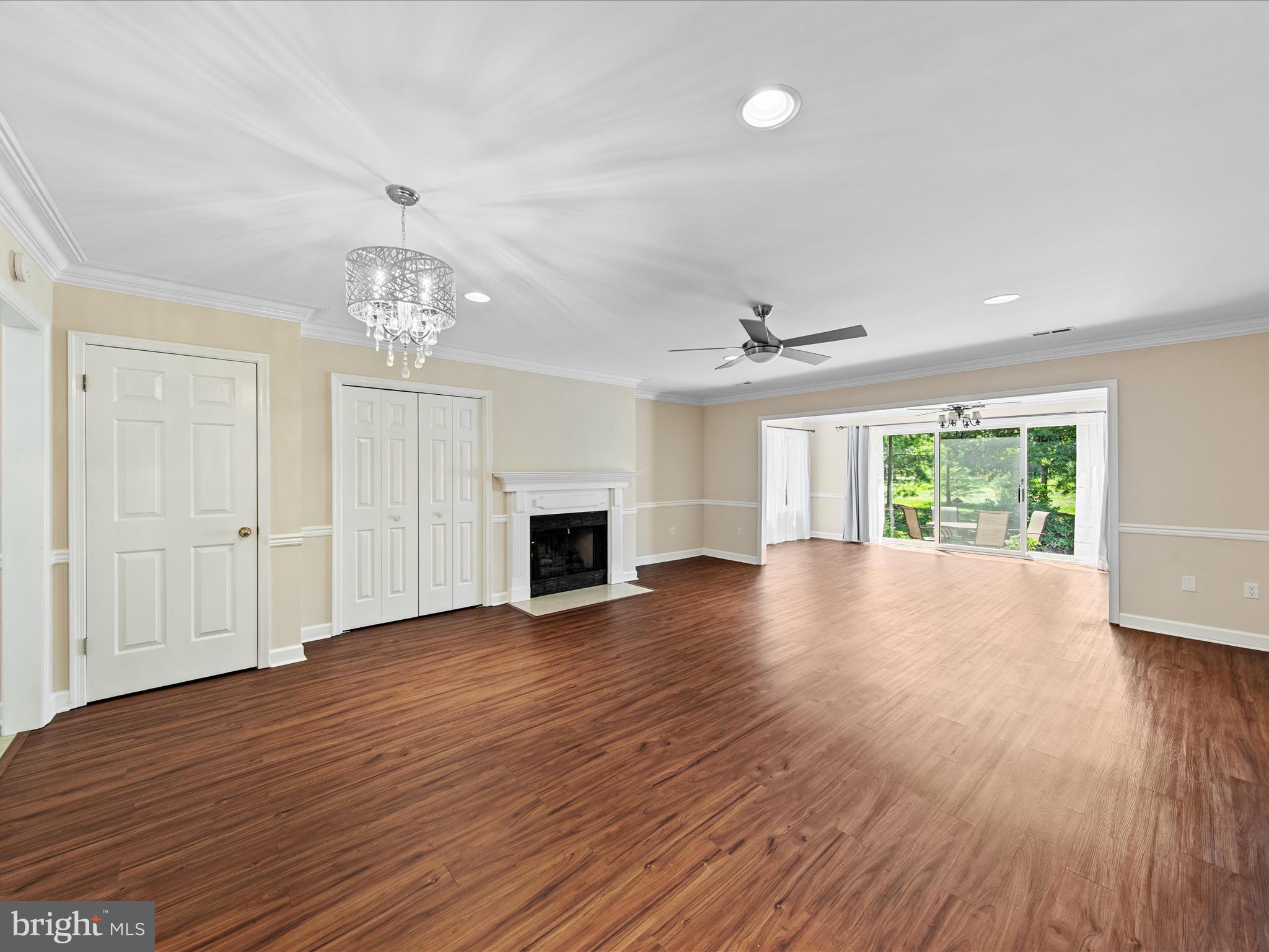24345 Widgeon Place, Unit 29 St. Michaels, MD 21663 - Photo 14 of 38 a view of empty room with wooden floor and fireplace