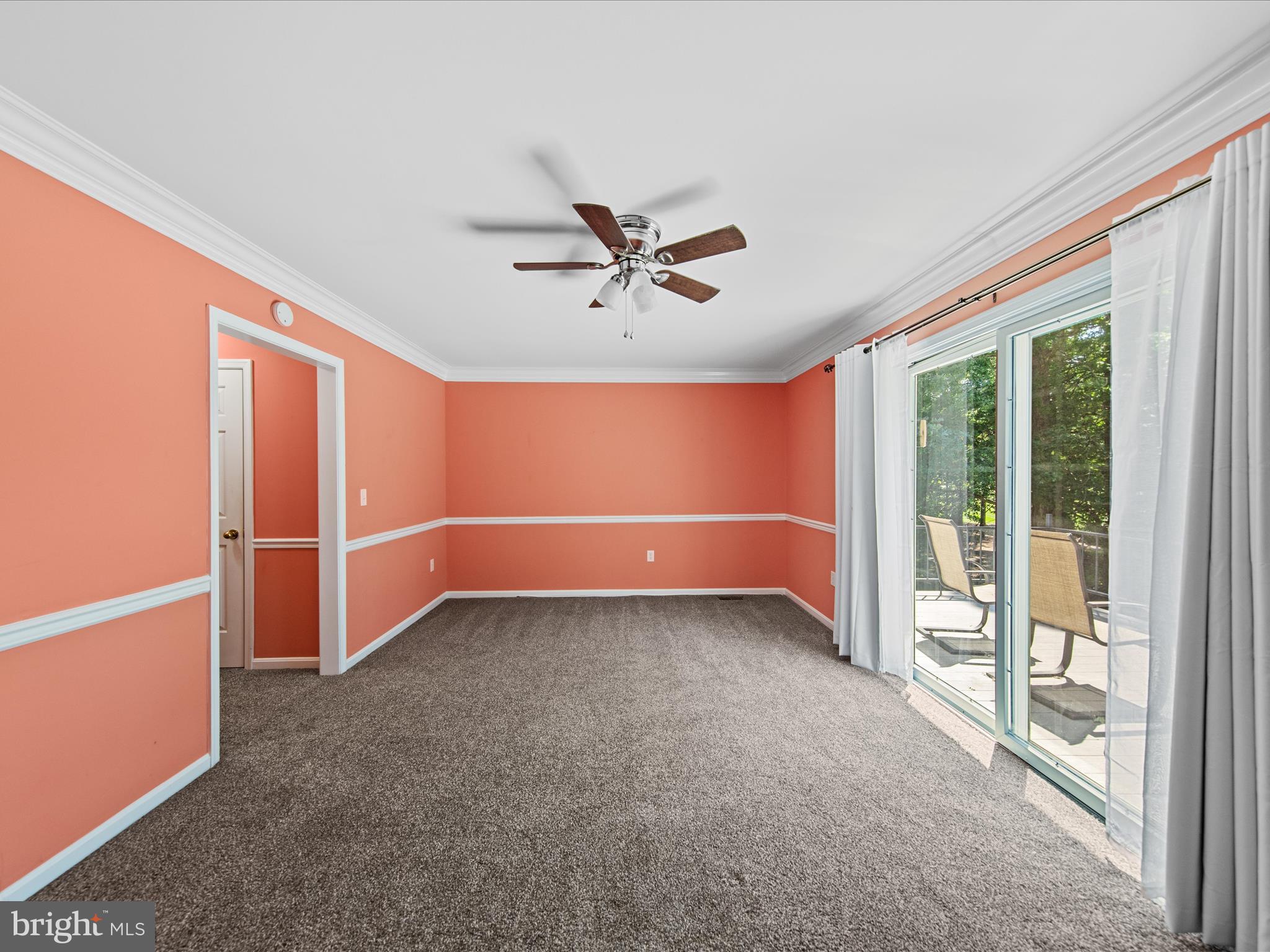 24345 Widgeon Place, Unit 29 St. Michaels, MD 21663 - Photo 21 of 38 an empty room with windows and fan