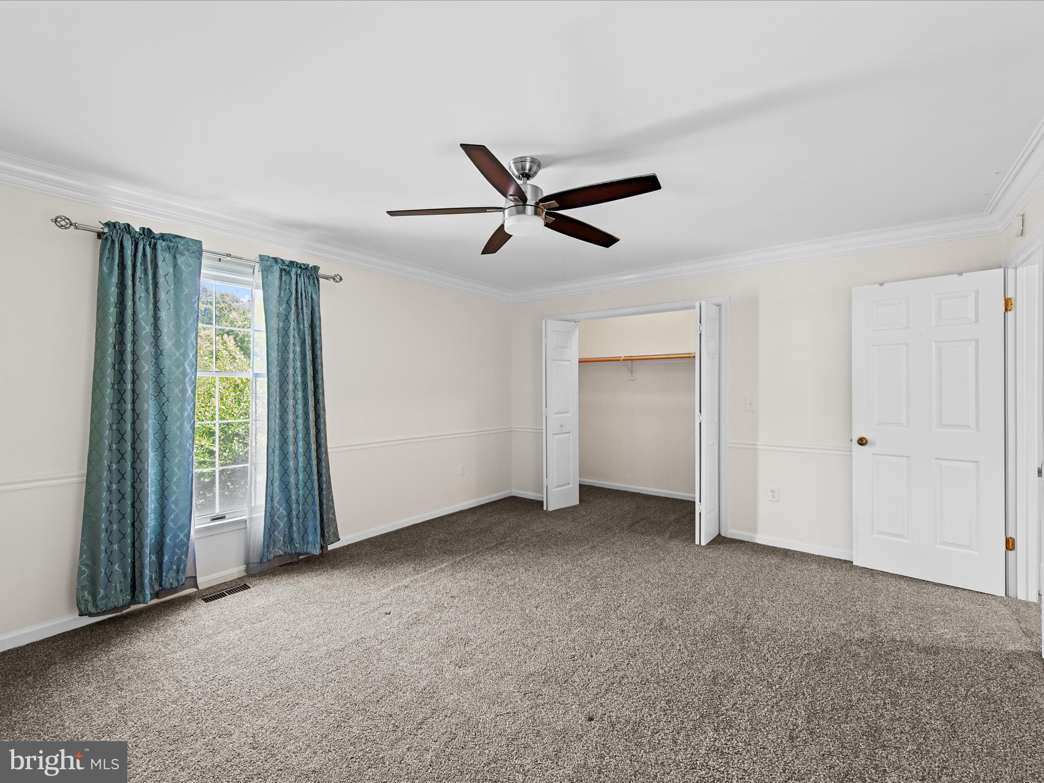 24345 Widgeon Place, Unit 29 St. Michaels, MD 21663 - Photo 27 of 38 a view of a livingroom with a ceiling fan and window