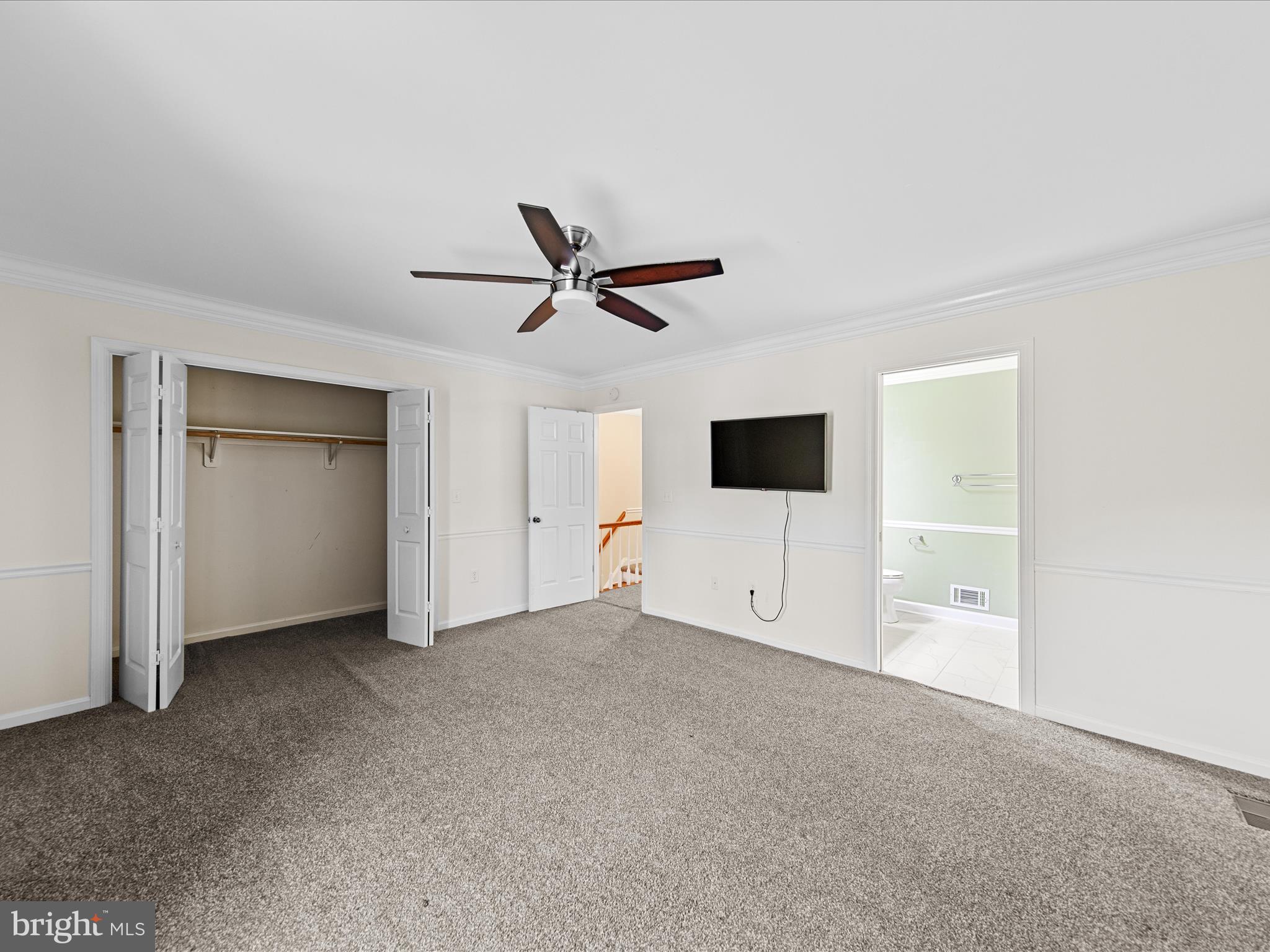 24345 Widgeon Place, Unit 29 St. Michaels, MD 21663 - Photo 28 of 38 a living room with a ceiling fan and a ceiling fan