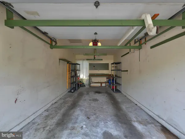 a view of a hallway with stairs