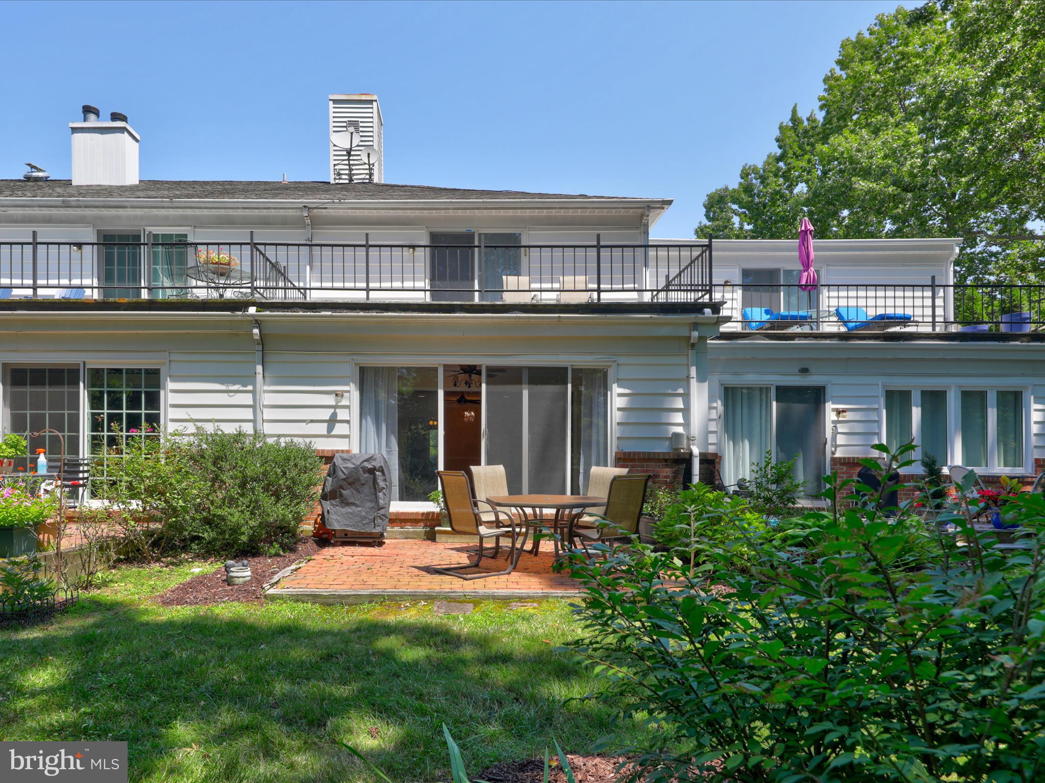 24345 Widgeon Place, Unit 29 St. Michaels, MD 21663 - Photo 4 of 38 front view of a building with a yard