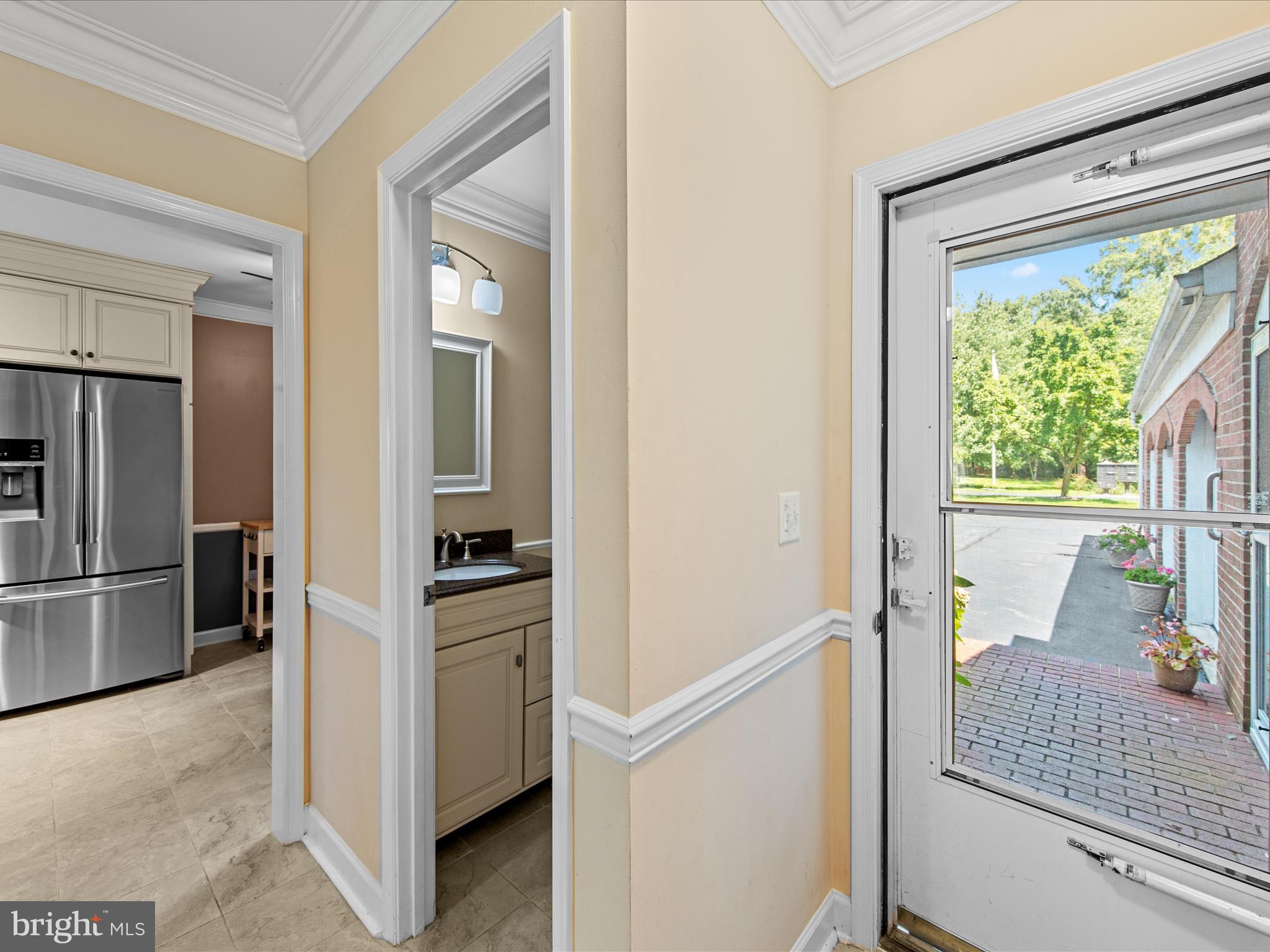 24345 Widgeon Place, Unit 29 St. Michaels, MD 21663 - Photo 5 of 38 a kitchen with a refrigerator and a sink