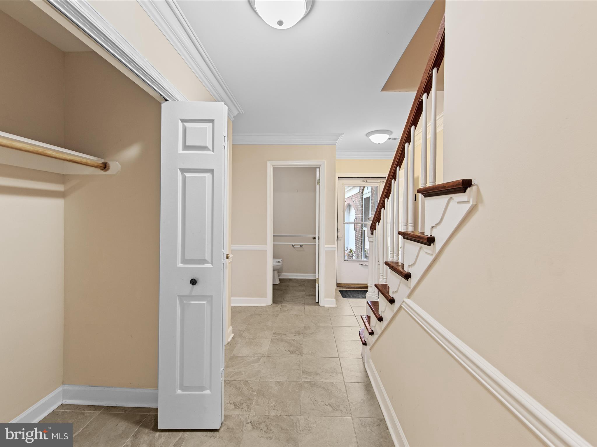 24345 Widgeon Place, Unit 29 St. Michaels, MD 21663 - Photo 7 of 38 a view of entryway with wooden floor and stairs