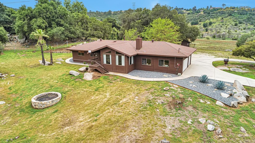28203 Turtle Rock Road Valley Center, CA 92082 - Photo 1 of 1 a view of a house with a yard