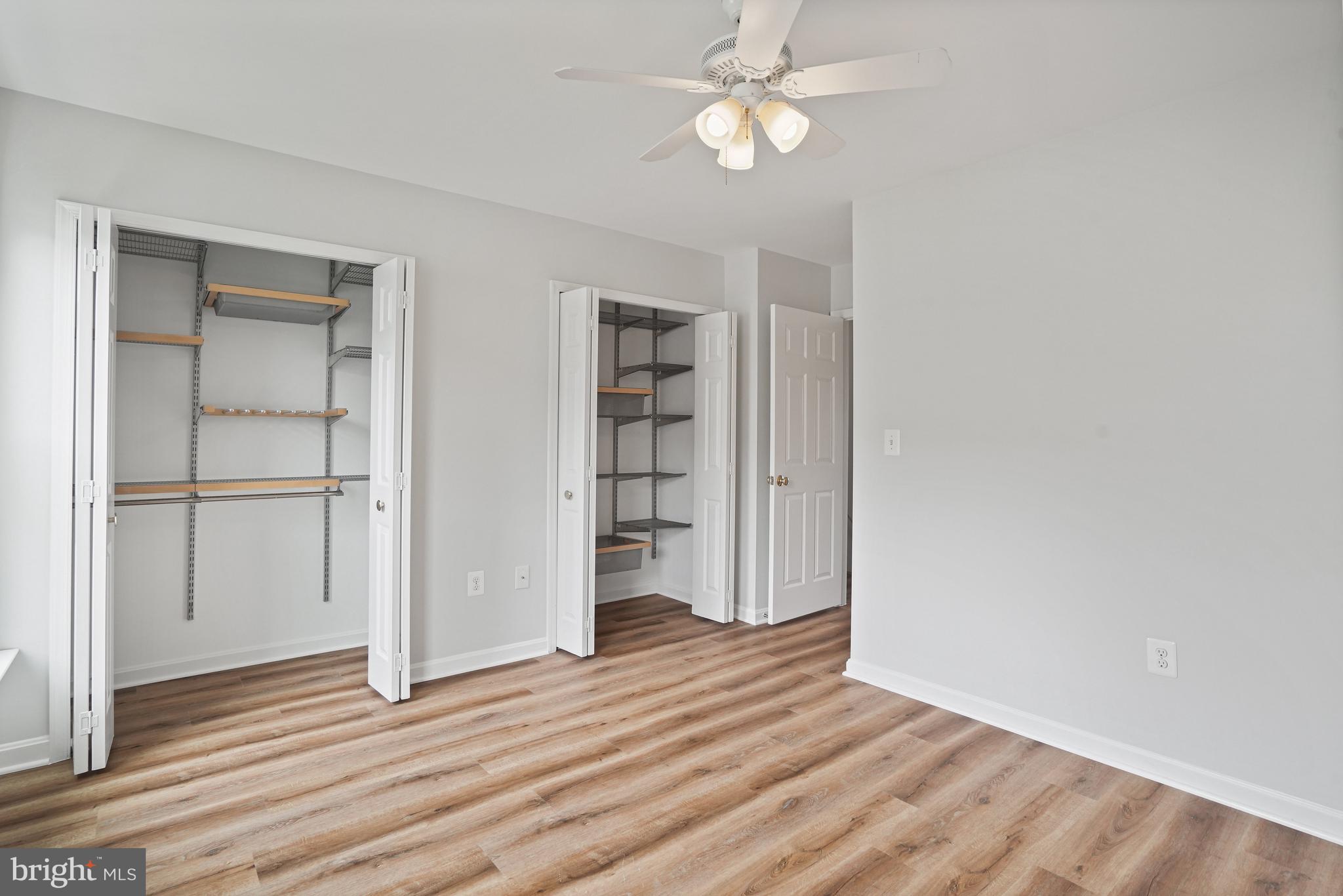 3823 9th Road South Arlington, VA 22204 - Photo 12 of 40 an empty room with wooden floor closet and windows
