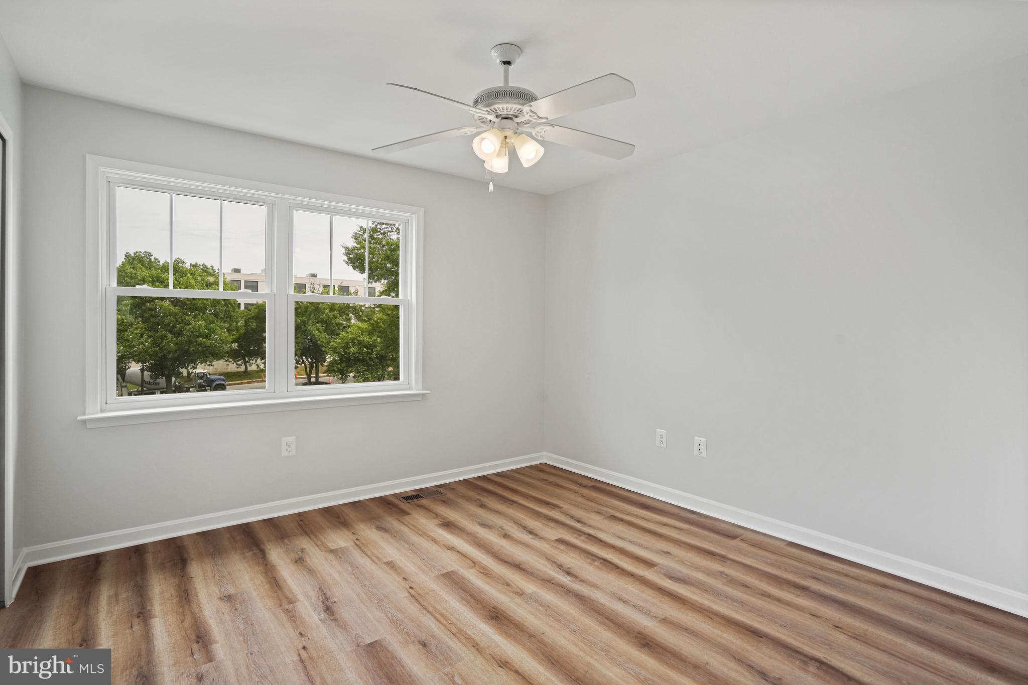3823 9th Road South Arlington, VA 22204 - Photo 16 of 40 wooden floor in an empty room with a window