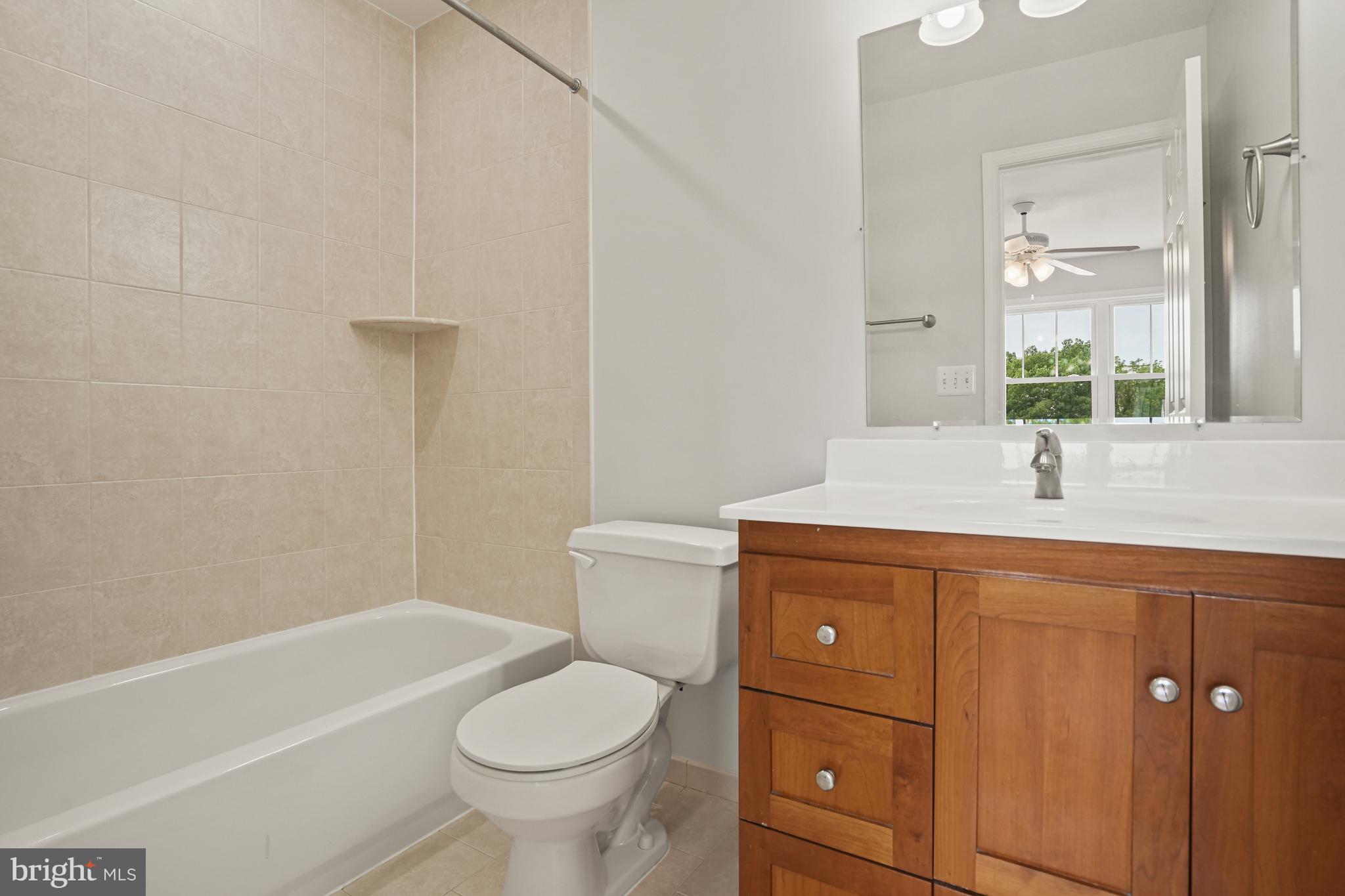3823 9th Road South Arlington, VA 22204 - Photo 20 of 40 a bathroom with a sink a toilet and shower