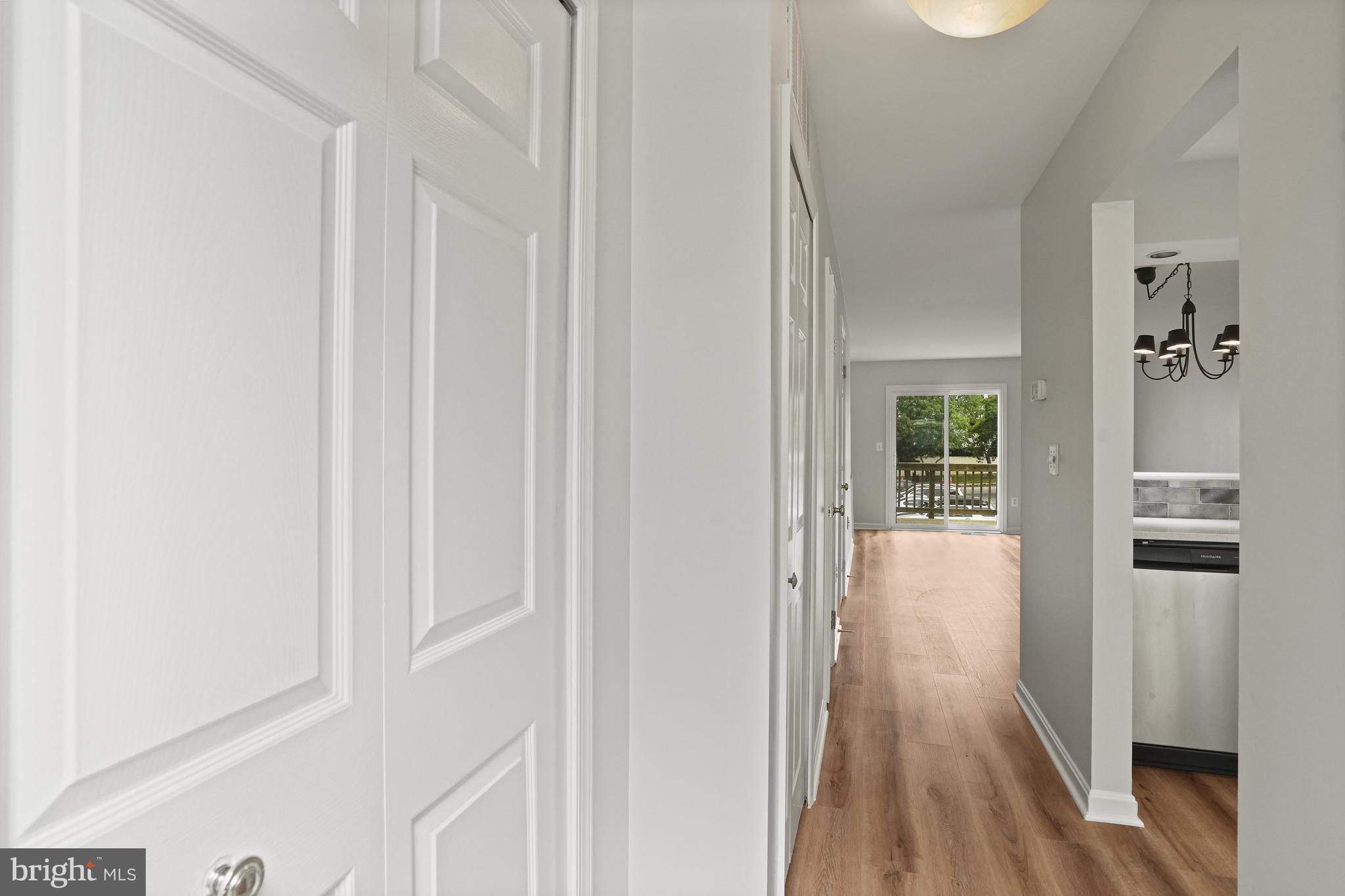3823 9th Road South Arlington, VA 22204 - Photo 21 of 40 a view of a hallway with wooden floor and a bathroom