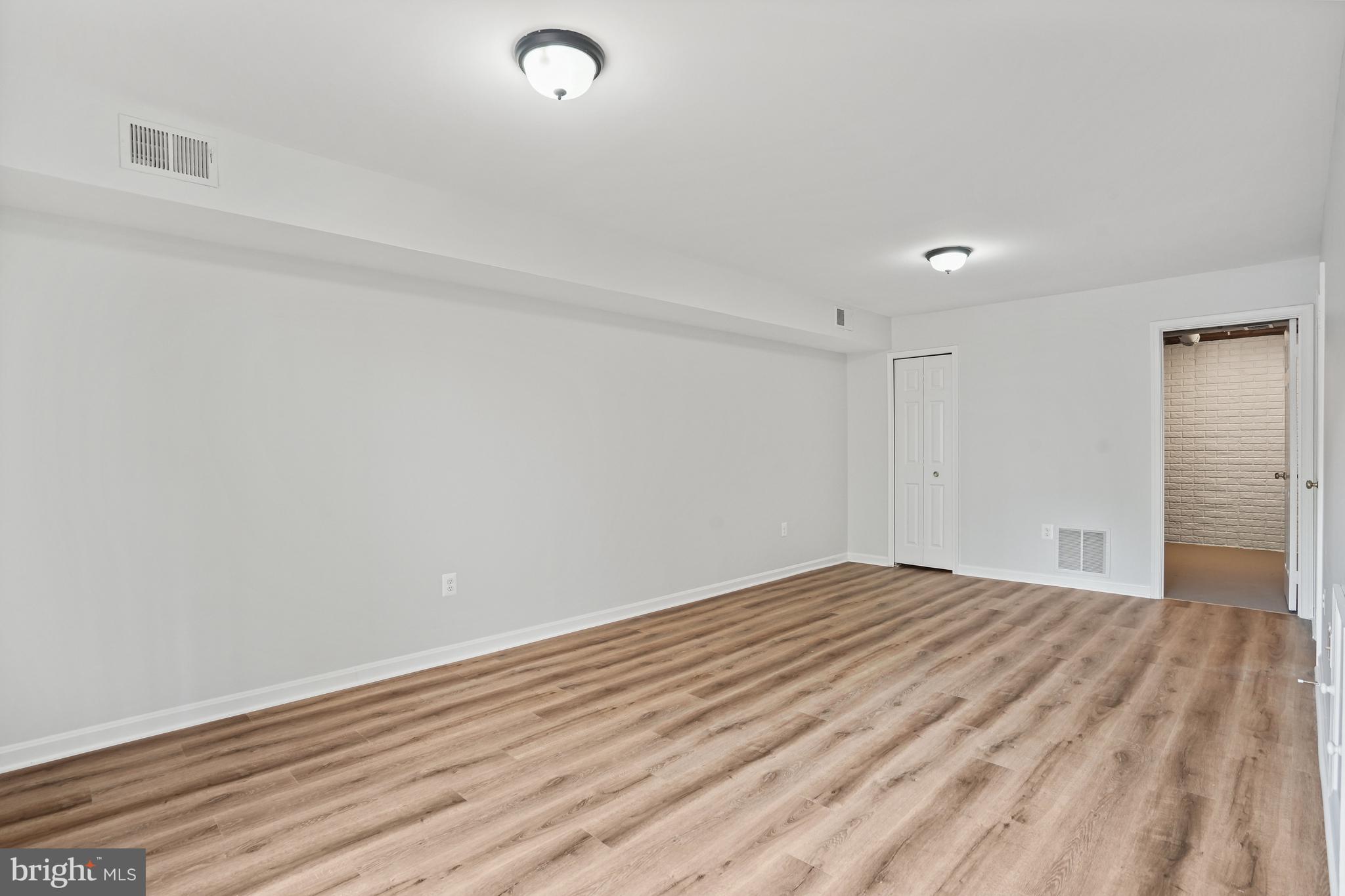 3823 9th Road South Arlington, VA 22204 - Photo 24 of 40 a view of room with wooden floor and fan