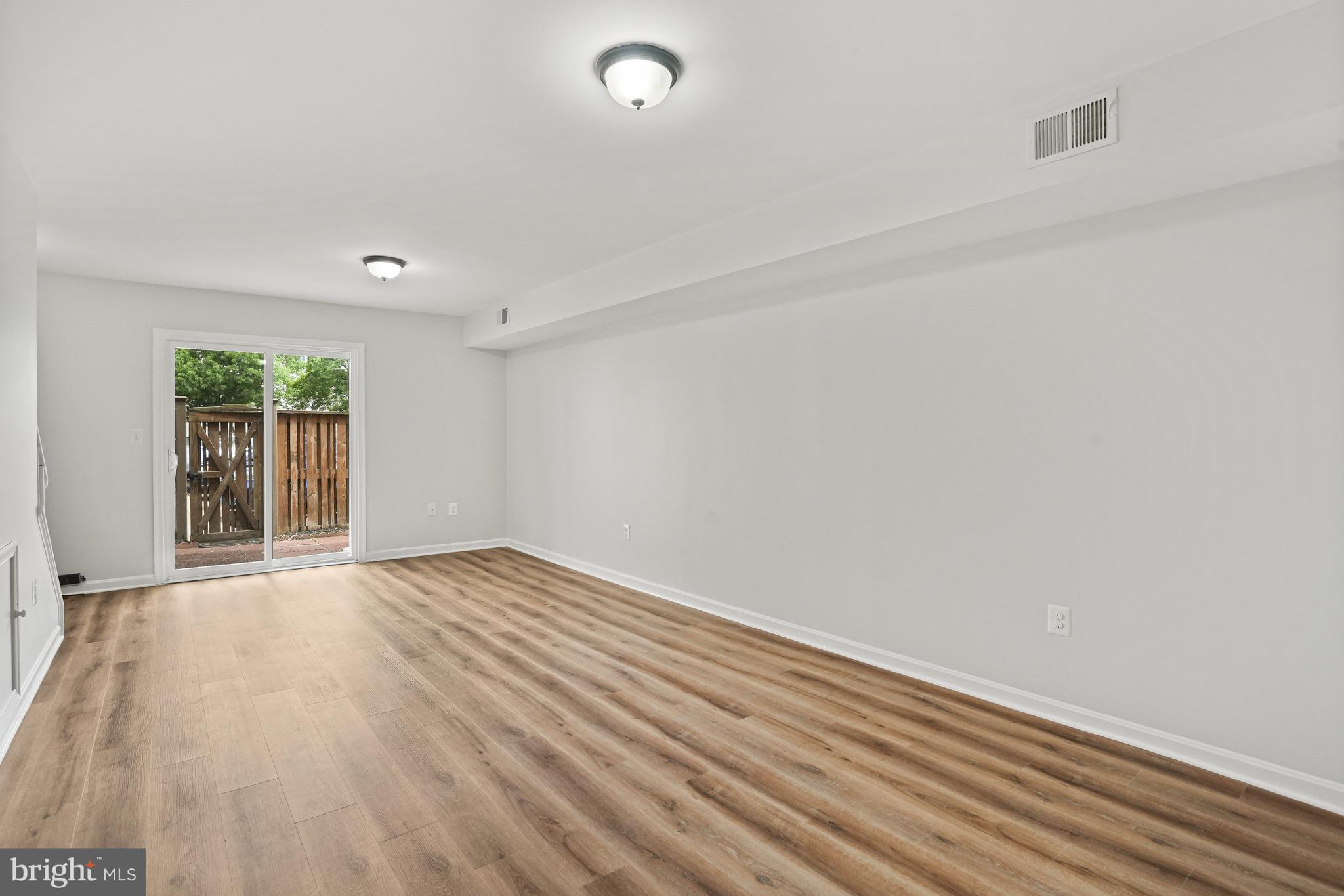 3823 9th Road South Arlington, VA 22204 - Photo 26 of 40 wooden floor in an empty room with a window