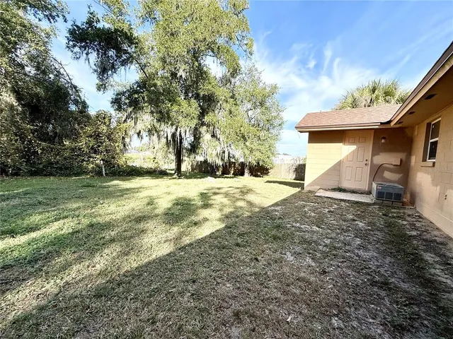 a view of a yard with a house and a yard