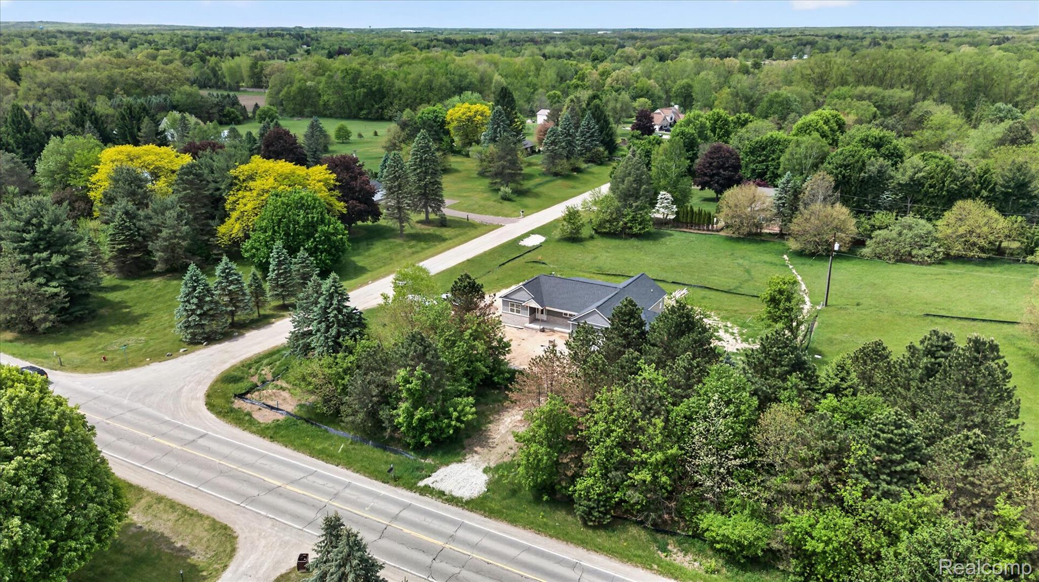 3297 Oak Grove Road Howell, MI 48855 - Photo 29 of 40 Bird’s-eye view of the property with convenient access and scenic surroundings.