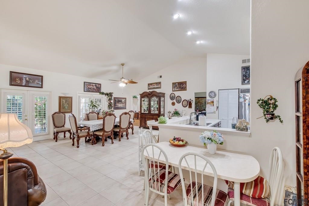 407 Domenico Circle St. Augustine, FL 32086 - Photo 15 of 33 a very nice looking dining room with kitchen island stainless steel appliances a table and chairs
