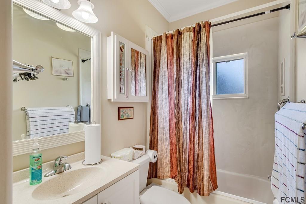 407 Domenico Circle St. Augustine, FL 32086 - Photo 28 of 33 a bathroom with a sink toilet and shower