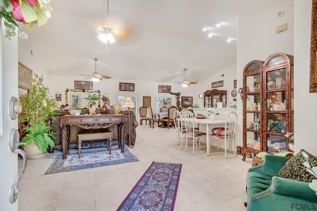407 Domenico Circle St. Augustine, FL 32086 - Photo 10 of 33 a living room with lots of furniture and a potted plant