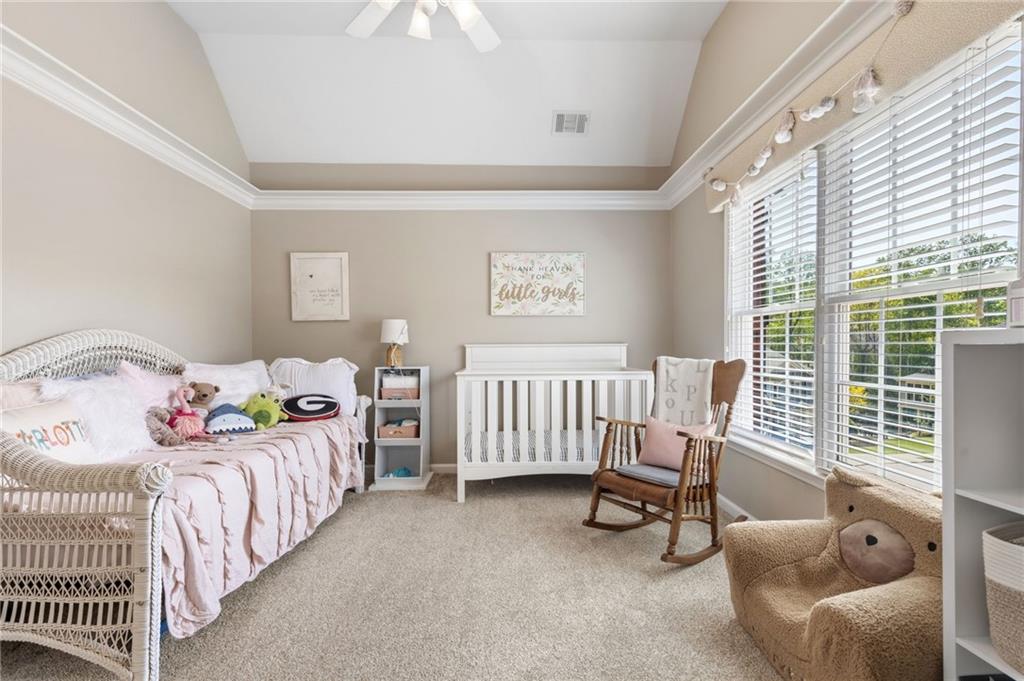 2964 Mill Grove Terrace Dacula, GA 30019 - Photo 35 of 86 a bedroom with three beds and a large window