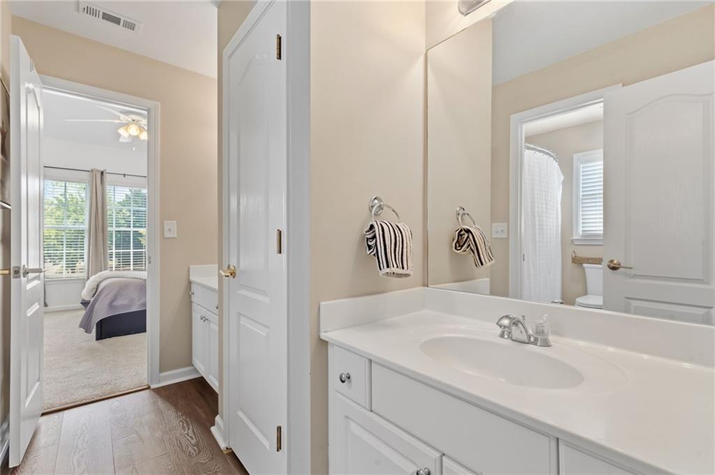 2964 Mill Grove Terrace Dacula, GA 30019 - Photo 40 of 86 a en suite bathroom with a sink and a mirror