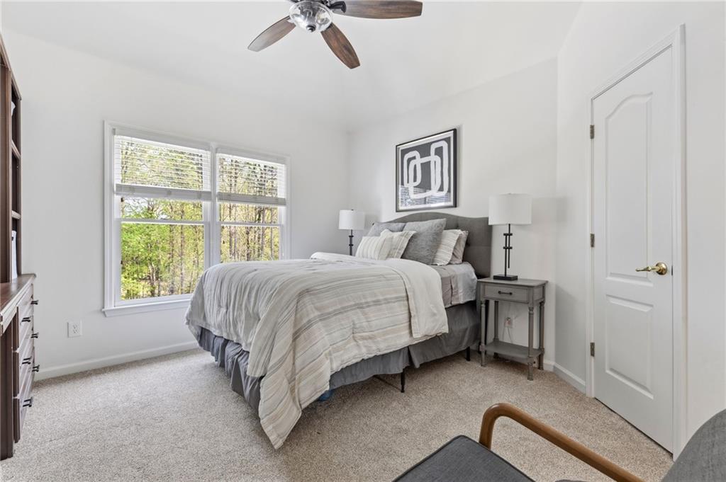 2964 Mill Grove Terrace Dacula, GA 30019 - Photo 41 of 86 a bed room with a bed and a chair