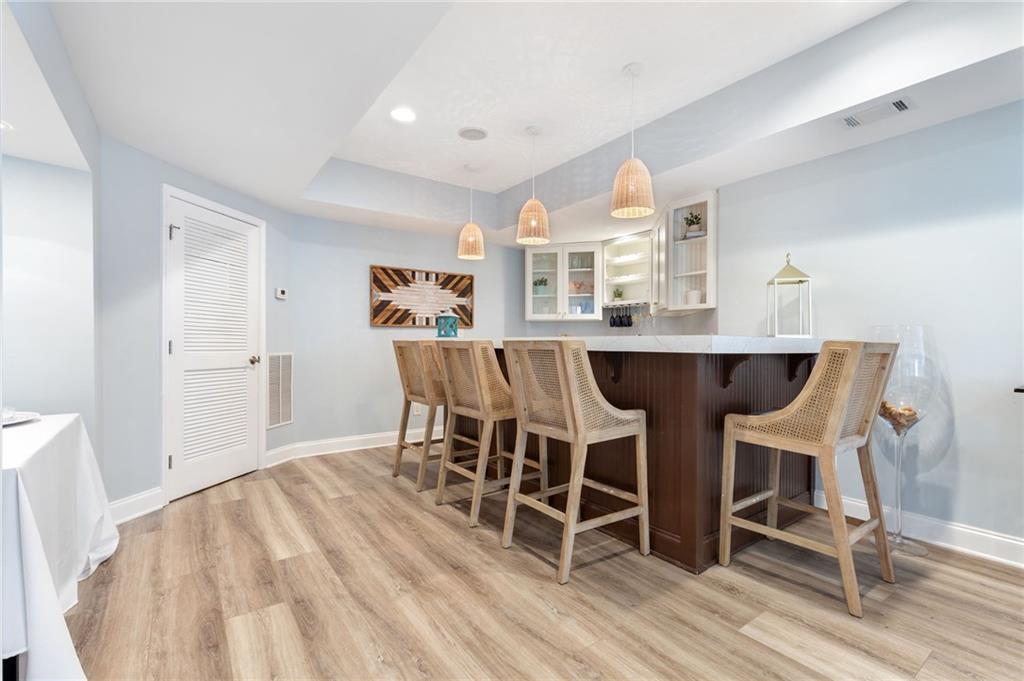 2964 Mill Grove Terrace Dacula, GA 30019 - Photo 48 of 86 a dining room with furniture and wooden floor