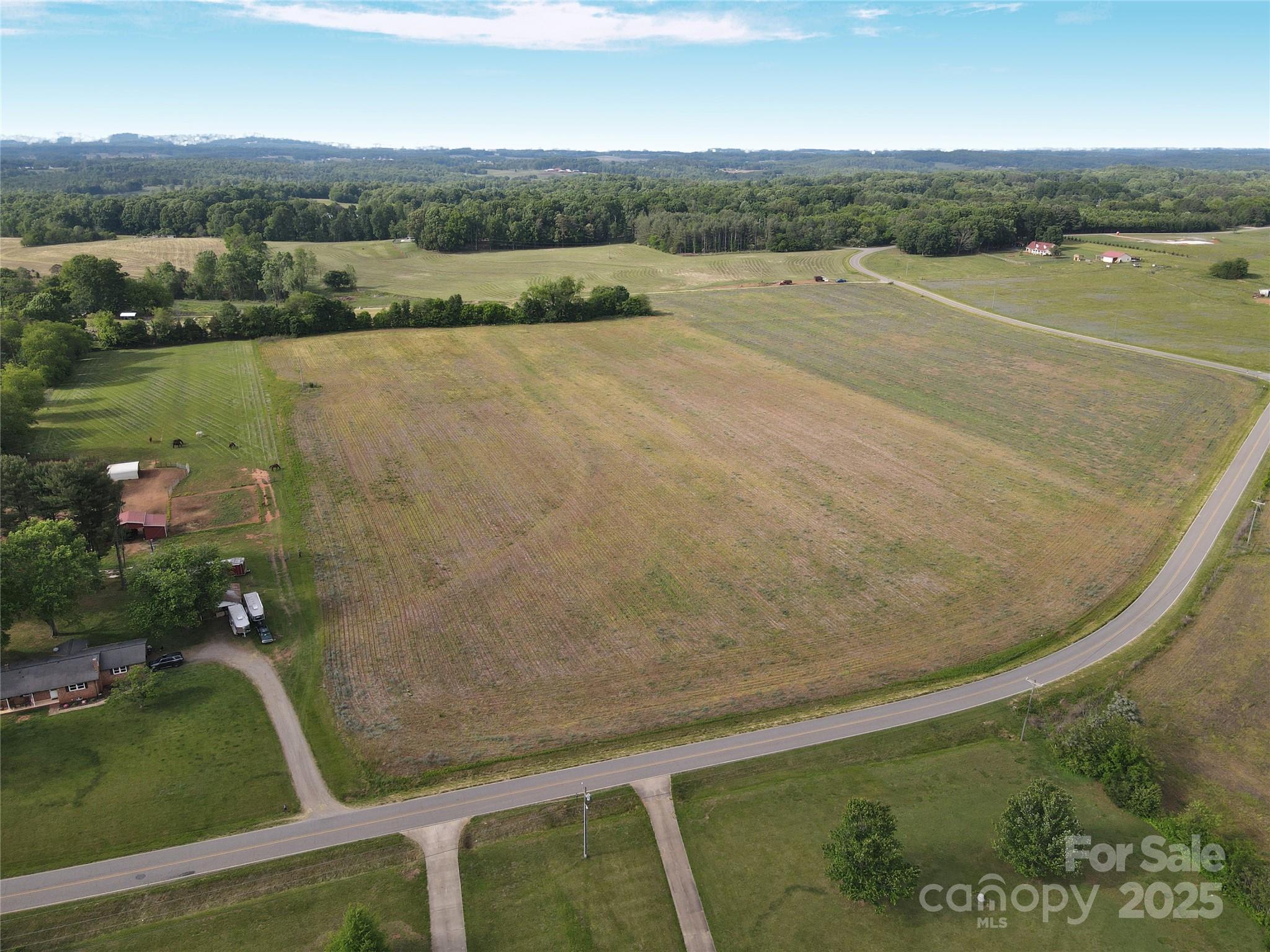 0 Trinity Road Statesville, NC 28625 - Photo 9 of 37 an aerial view of a house with a yard and lake view