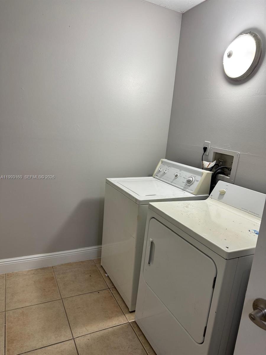 5780 Rock Island Road, Unit 362 Tamarac, FL 33319 - Photo 9 of 10 a utility room with dryer and washer