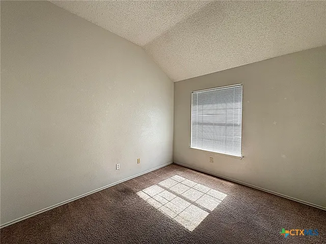 a bathroom with a toilet and a bathtub