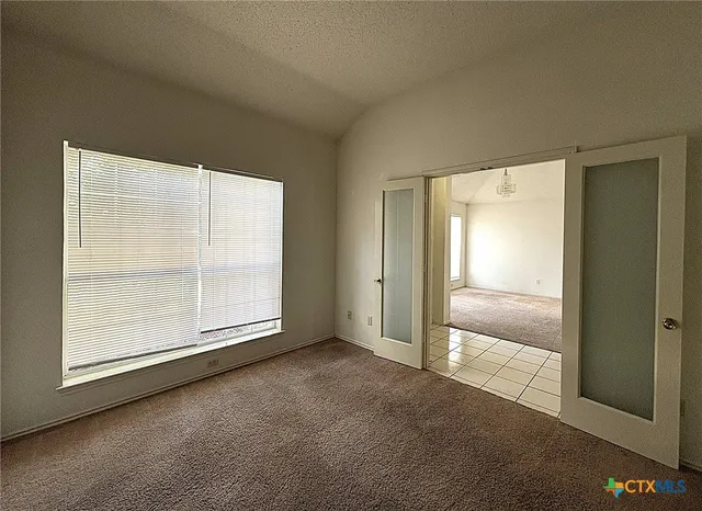 a bathroom with bathtub and window