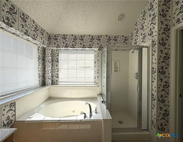 an empty room with a empty space and windows