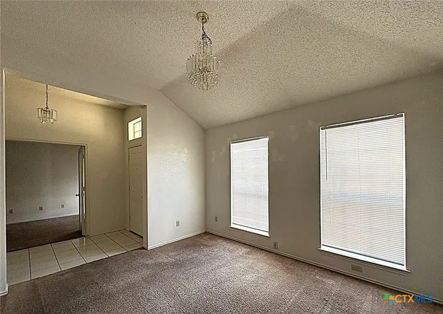 an empty room with a empty space and window