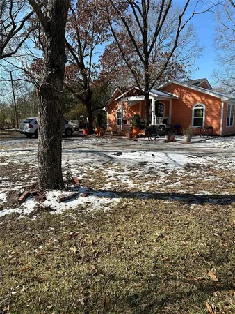 a view of a yard with a tree