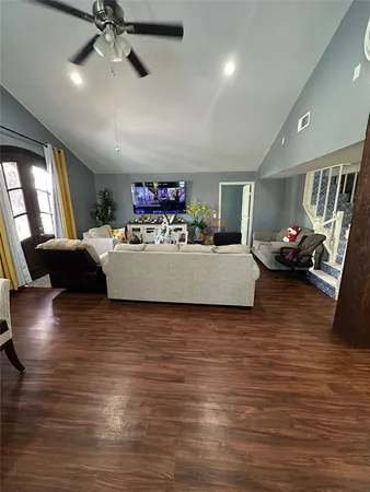 a view of a room with workspace and a window