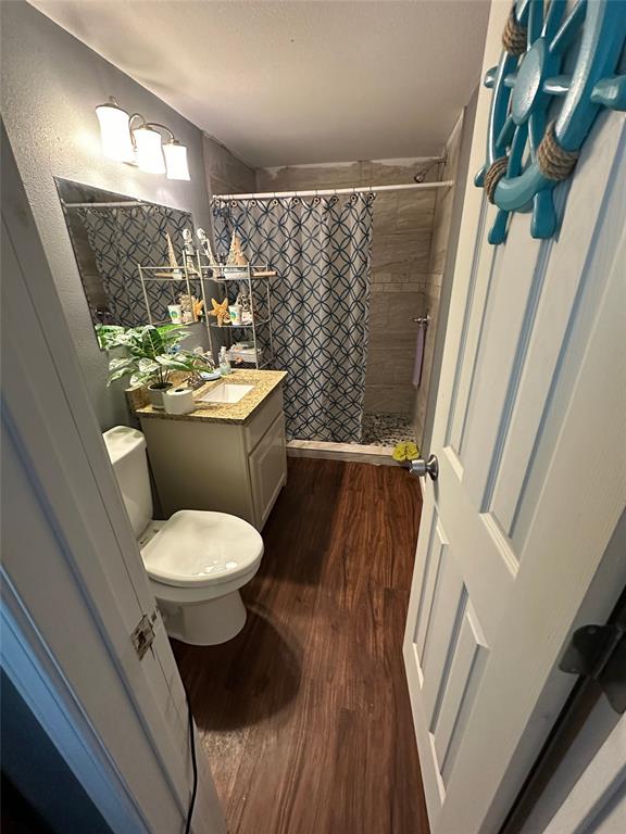 2839 Harts Bluff Road Mount Pleasant, TX 75455 - Photo 15 of 27 a bathroom with a toilet and a sink