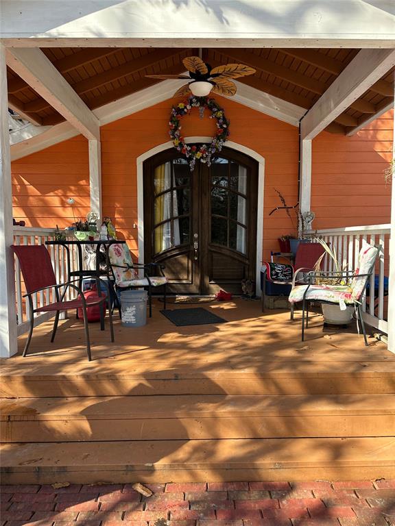 2839 Harts Bluff Road Mount Pleasant, TX 75455 - Photo 2 of 27 a view of a swimming pool with a chairs in patio
