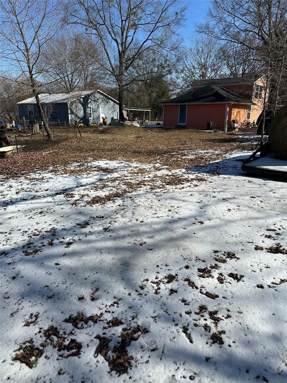 2839 Harts Bluff Road Mount Pleasant, TX 75455 - Photo 23 of 27 a view of a yard with a large tree