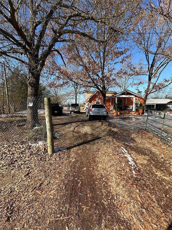 2839 Harts Bluff Road Mount Pleasant, TX 75455 - Photo 26 of 27 a view of a yard with a tree