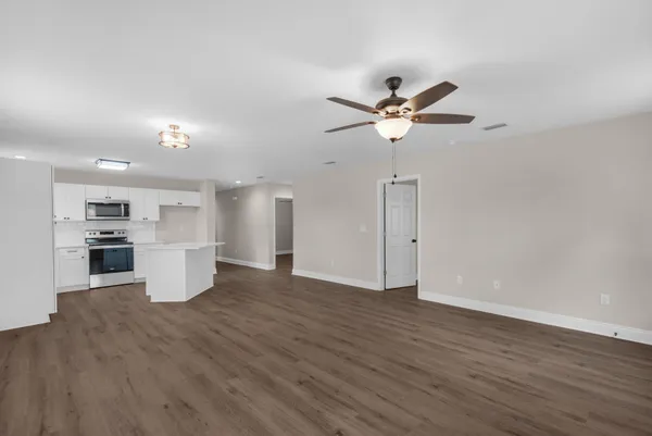 a view of a kitchen with a sink and a stove top oven