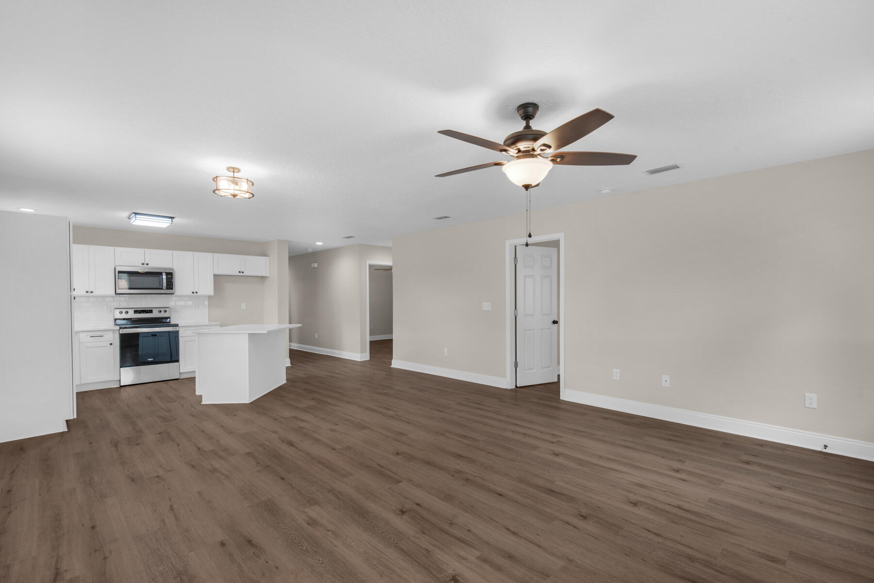 5438 Bayleaf Drive Crestview, FL 32539 - Photo 16 of 35 a view of a kitchen with a sink and a stove top oven
