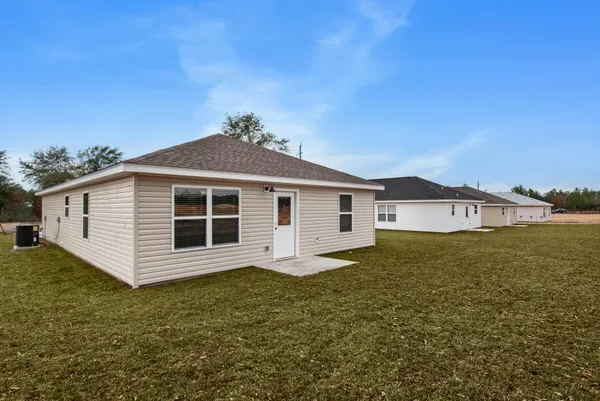 a house view with a backyard space