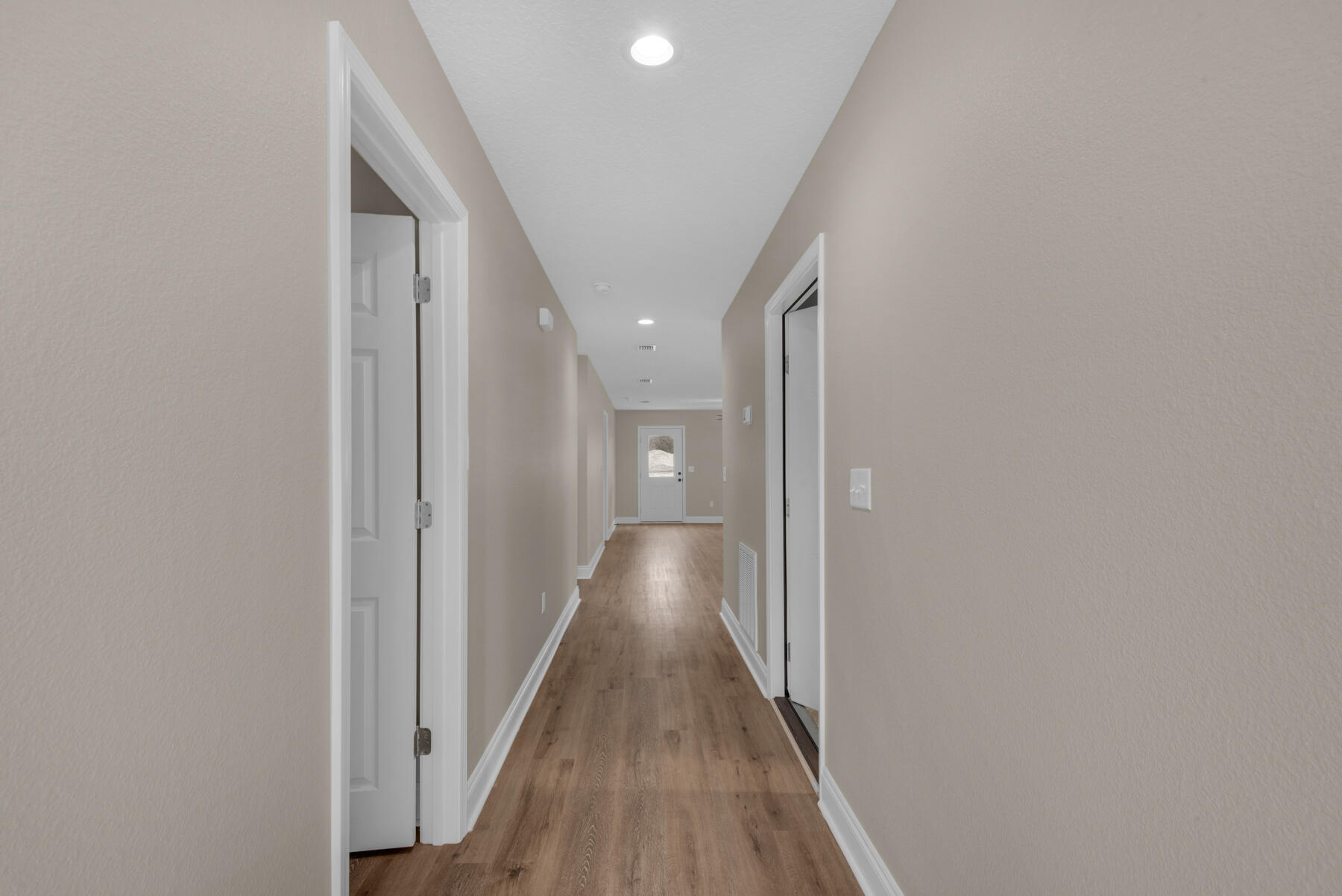 5438 Bayleaf Drive Crestview, FL 32539 - Photo 6 of 35 a view of a hallway with wooden floor